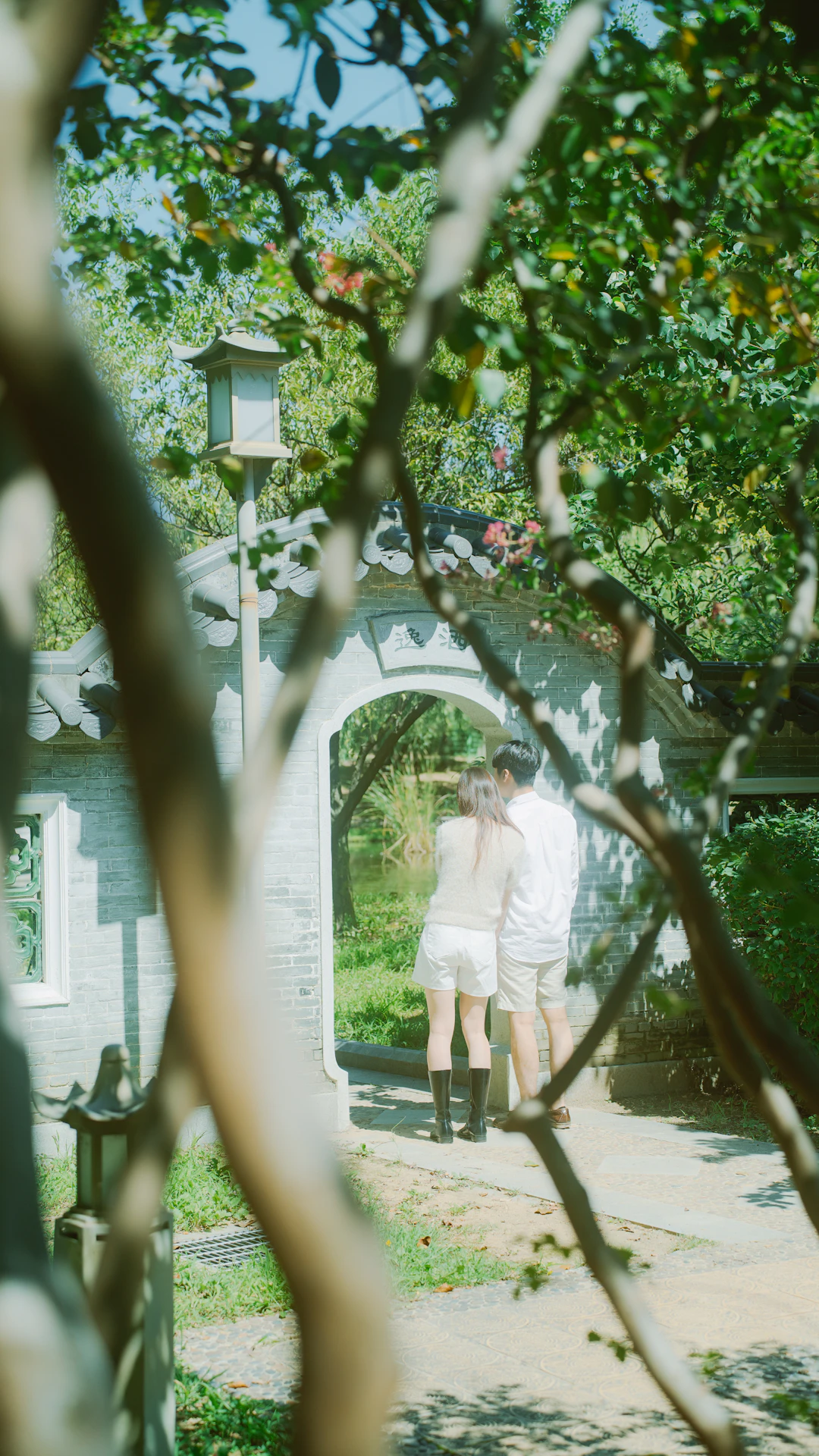 Couple embracing in a garden archway garden