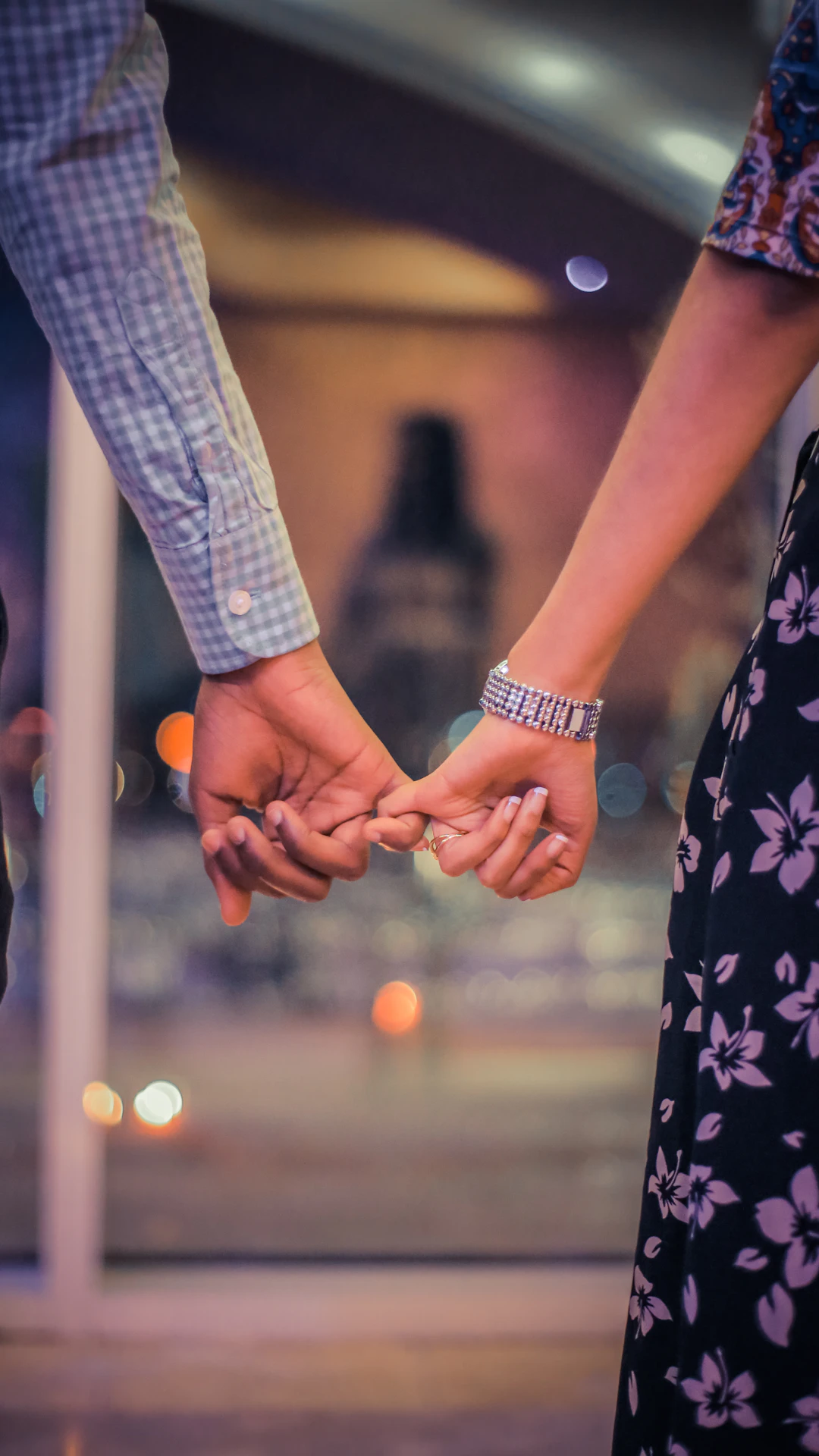 man and woman holding hands