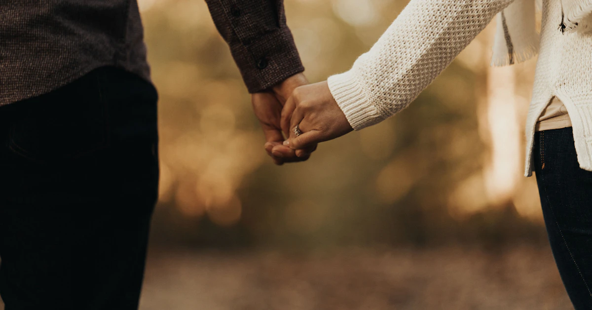 woman and man holding hands