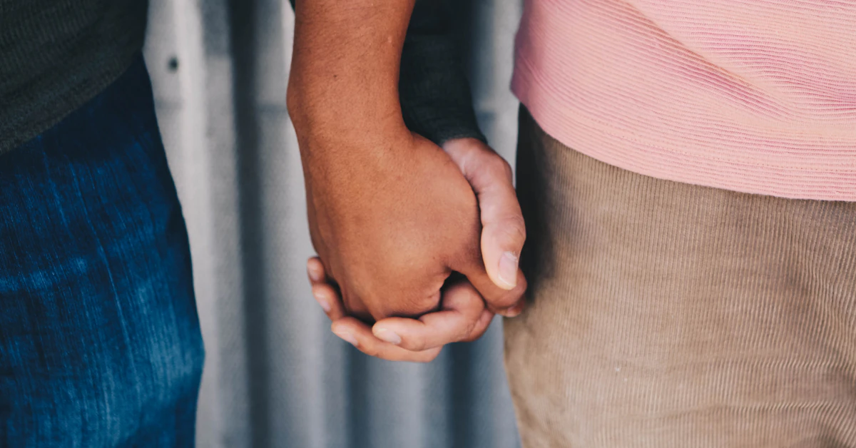 focus photo of couple's hands